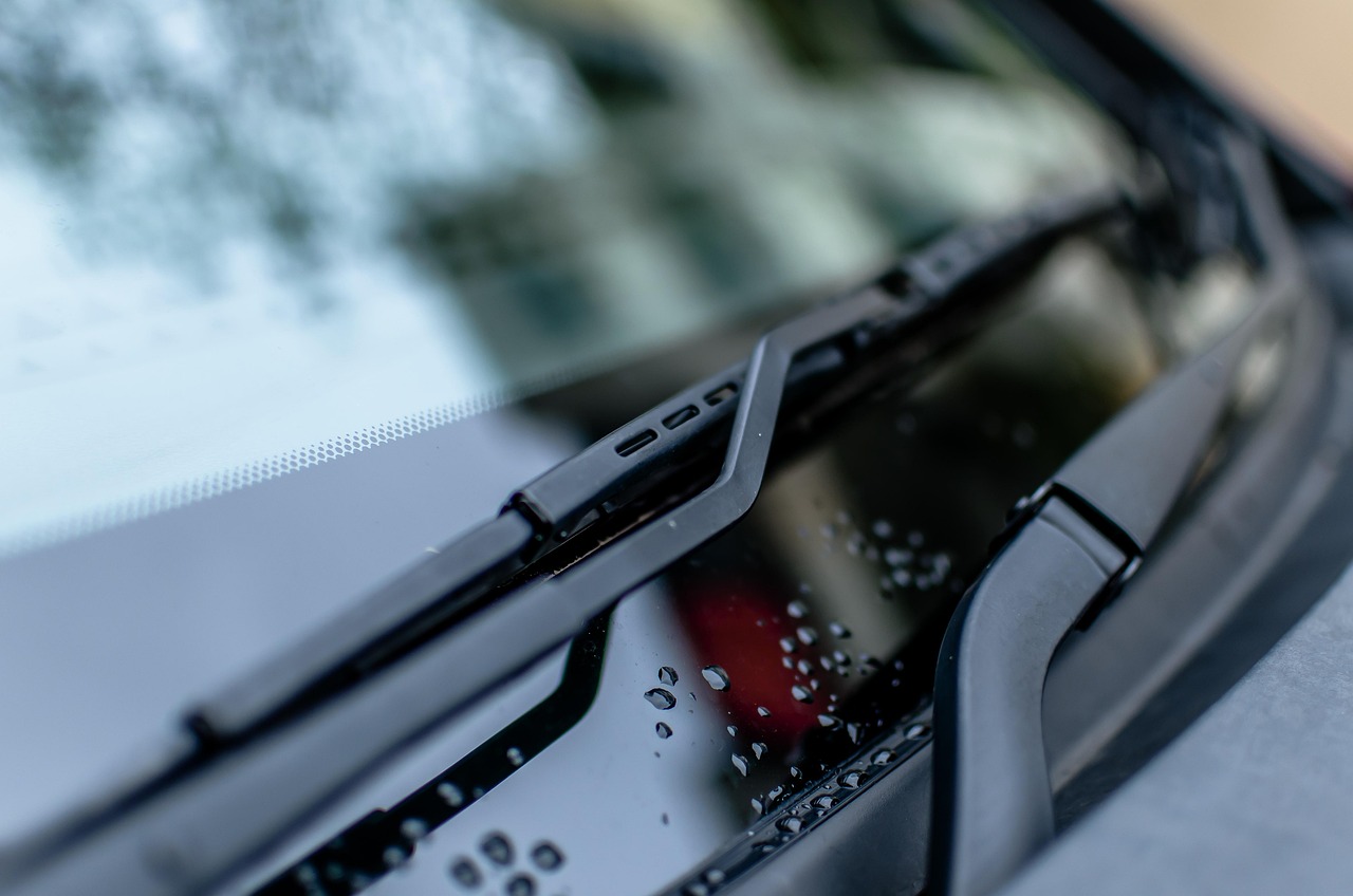 Close view of a windshield and wiper on a parked car
